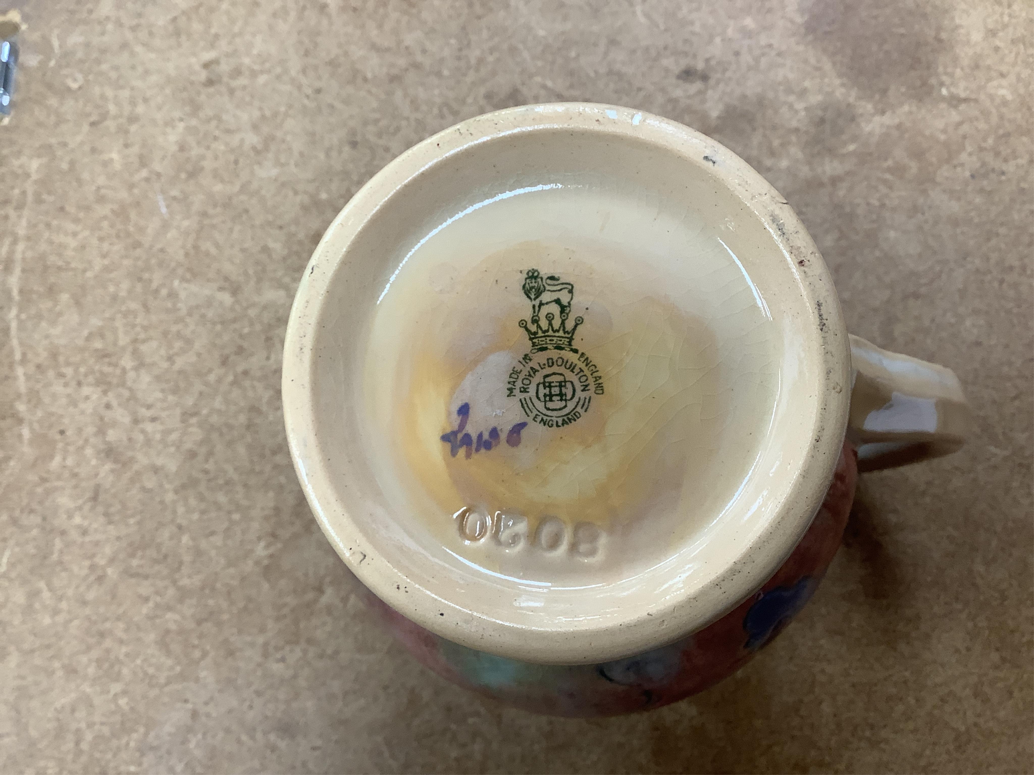 A Royal Doulton pottery jug, designed by Frank Brangwyn, numbered 8020, 15cm high